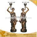 indoor beautiful cast bronze sculpture of sitting lady with lamp